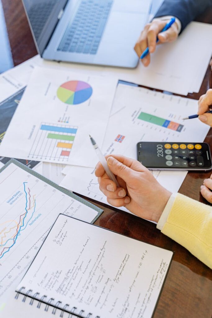 pexels-photo-5816298 A close-up of businesspeople analyzing financial data and charts during a meeting.
